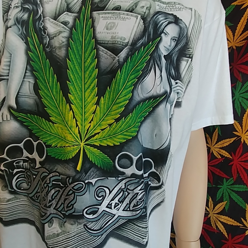 White tee with large green leaf